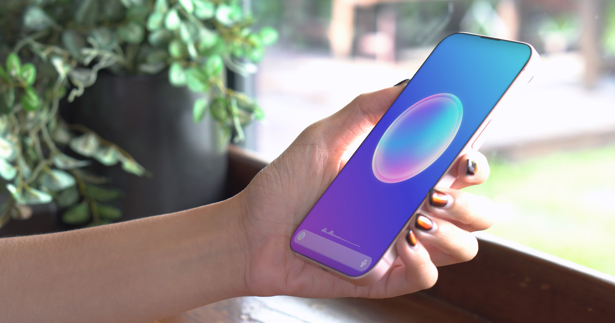 Person interacting with an AI virtual assistant on their phone