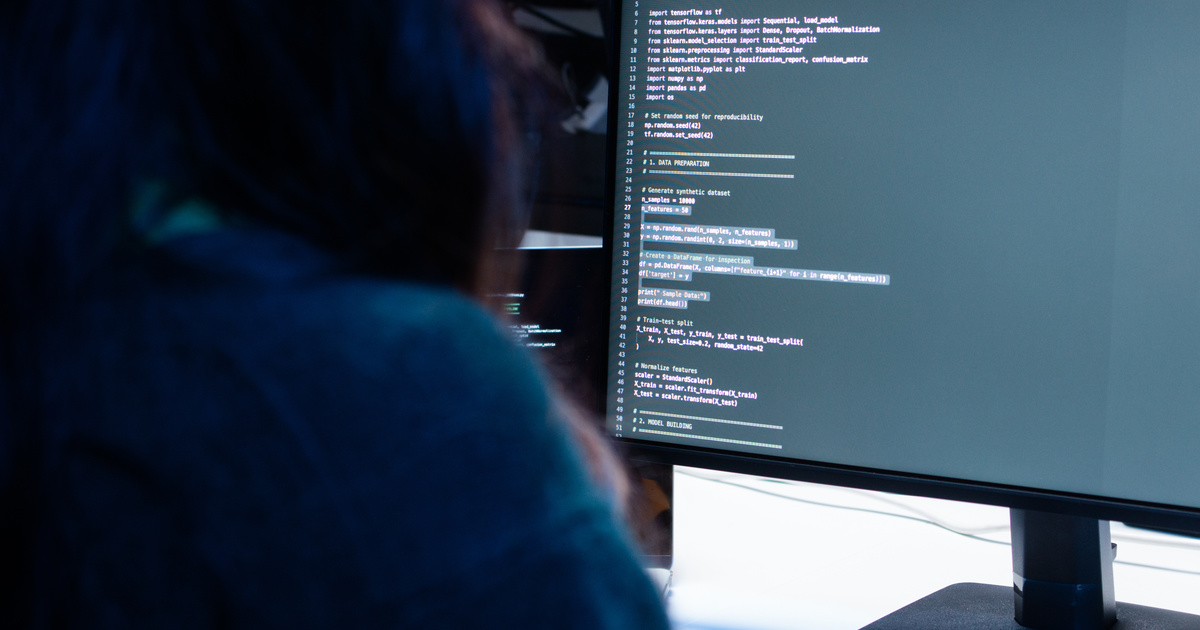 Person working with artificial intelligence on a computer to build a website